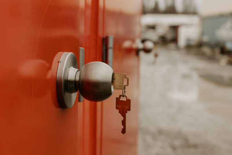 Close-up of a secure keyed door lock on a restroom trailer